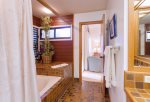 Roman style soaking tub, 2 separate vanities, private toilet in master bath